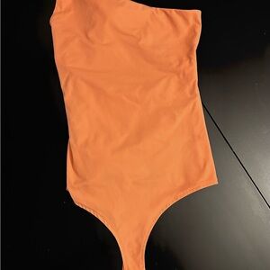 Adreamly One piece body suit with snap crotch.